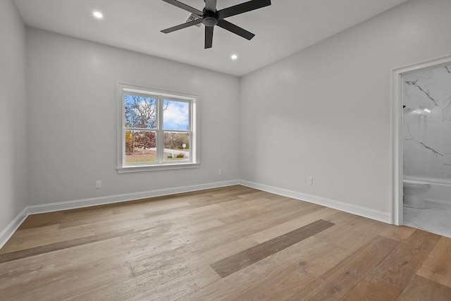 unfurnished room with ceiling fan and light hardwood / wood-style flooring