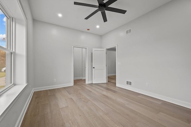 unfurnished bedroom featuring ceiling fan and light wood-type flooring