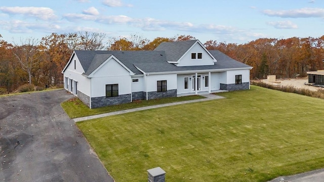 view of front of property with french doors and a front yard