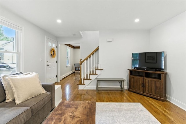 6 Flagg Dr, Framingham, MA 01702 - living room featuring wood finished floors, stairway, recessed lighting, and a baseboard heating unit