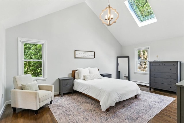 6 Flagg Dr, Framingham, MA 01702 - bedroom featuring a skylight, multiple windows, a chandelier, a baseboard heating unit, and high vaulted ceiling