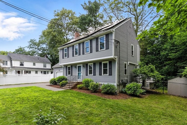 6 Flagg Dr, Framingham, MA 01702 - colonial home featuring a garage and a chimney