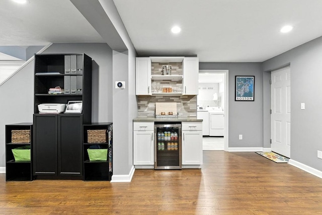 6 Flagg Dr, Framingham, MA 01702 - bar area with wine cooler, independent washer and dryer, wood finished floors, tasteful backsplash, and recessed lighting