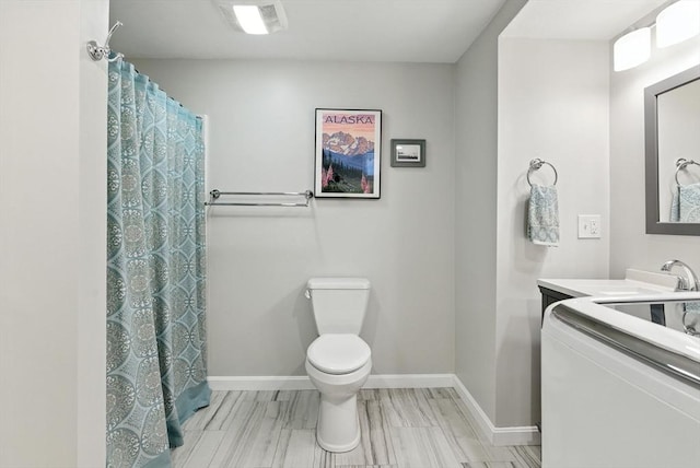 6 Flagg Dr, Framingham, MA 01702 - bathroom featuring vanity and washer / clothes dryer