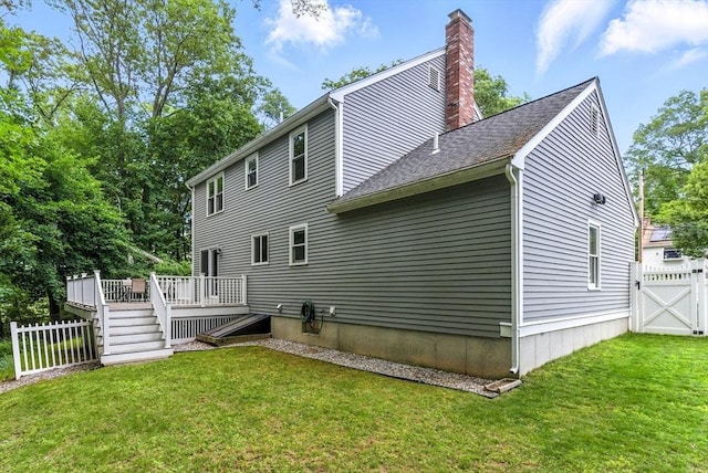 6 Flagg Dr, Framingham, MA 01702 - rear view of property featuring a wooden deck, a chimney, roof with shingles, and a gate