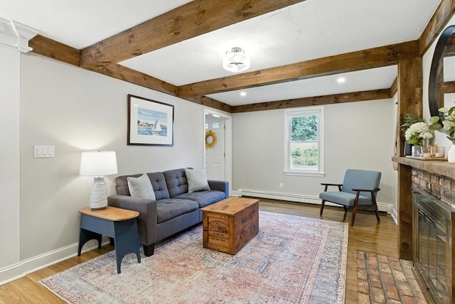 6 Flagg Dr, Framingham, MA 01702 - living area featuring wood finished floors, a baseboard radiator, beam ceiling, recessed lighting, and a brick fireplace