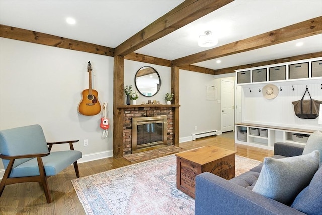 6 Flagg Dr, Framingham, MA 01702 - living room with a baseboard heating unit, wood finished floors, beamed ceiling, a fireplace, and recessed lighting