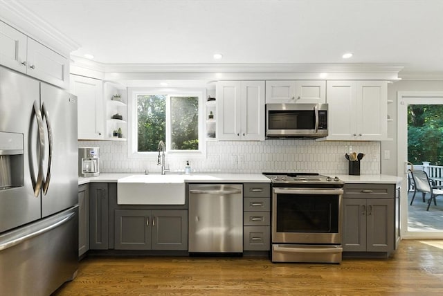 6 Flagg Dr, Framingham, MA 01702 - kitchen featuring open shelves, appliances with stainless steel finishes, gray cabinetry, ornamental molding, and recessed lighting