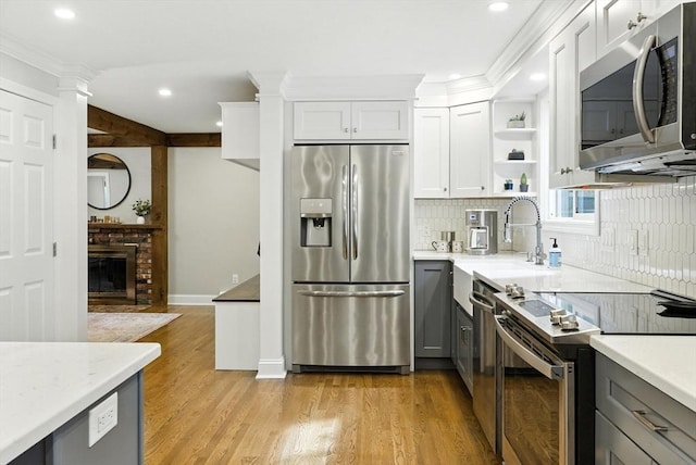 6 Flagg Dr, Framingham, MA 01702 - kitchen with appliances with stainless steel finishes, gray cabinetry, open shelves, decorative backsplash, and recessed lighting