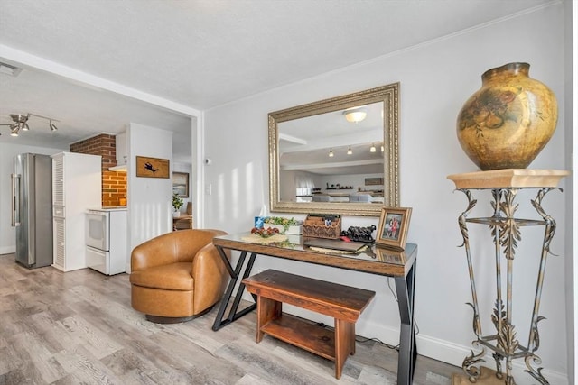 sitting room with hardwood / wood-style flooring