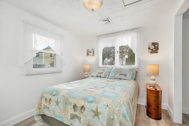 bedroom featuring light hardwood / wood-style floors