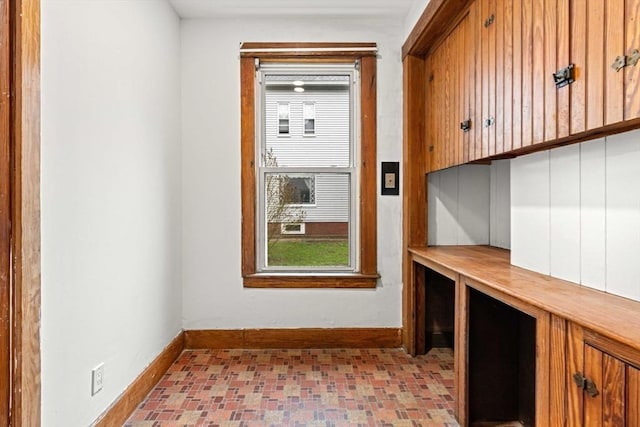 unfurnished office with baseboards