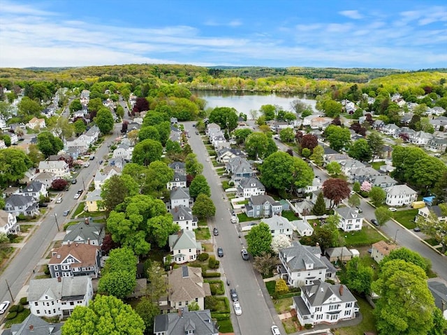aerial view of residential area featuring a nearby body of water