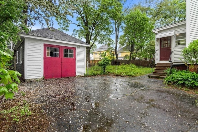 garage with fence