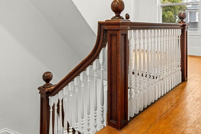 staircase with wood finished floors