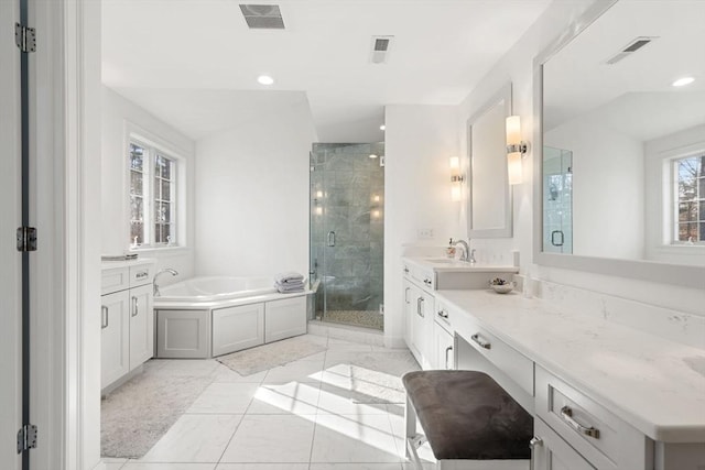 full bathroom with visible vents, a garden tub, marble finish floor, a stall shower, and vanity