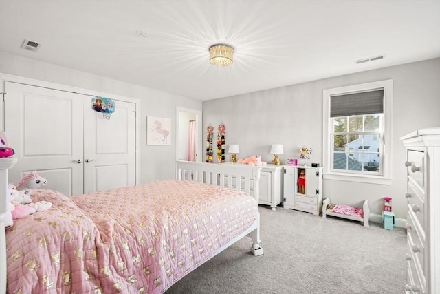 bedroom featuring light carpet, visible vents, and a closet