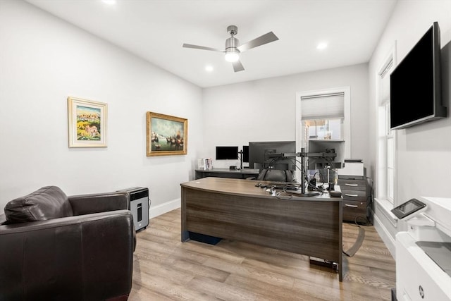 office space with recessed lighting, baseboards, light wood-type flooring, and a ceiling fan