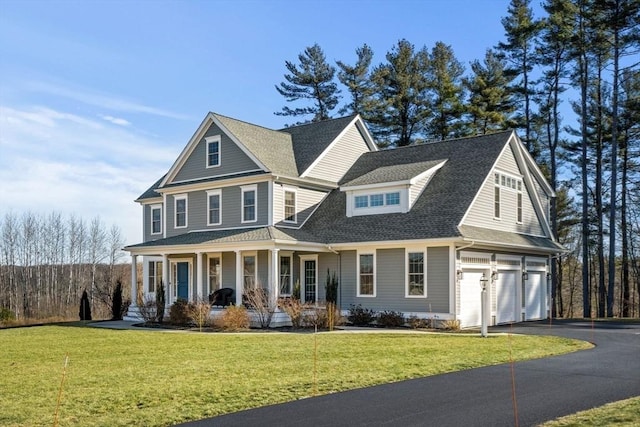 view of front of home featuring driveway, roof with shingles, an attached garage, covered porch, and a front lawn