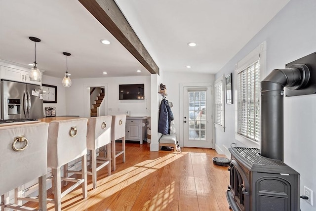 interior space featuring hardwood / wood-style flooring and a wood stove