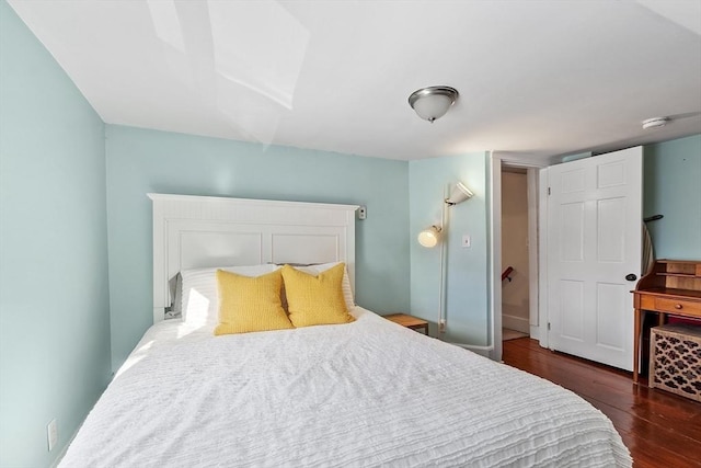 bedroom featuring dark hardwood / wood-style floors