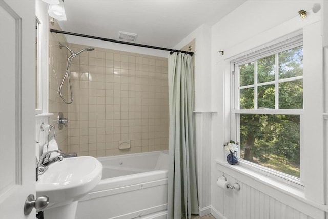 235 Groton Rd, Chelmsford, MA 01863 - bathroom with shower / bath combination with curtain and a sink
