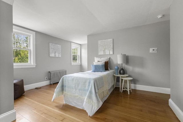 235 Groton Rd, Chelmsford, MA 01863 - bedroom with radiator heating unit, hardwood / wood-style floors, and baseboards