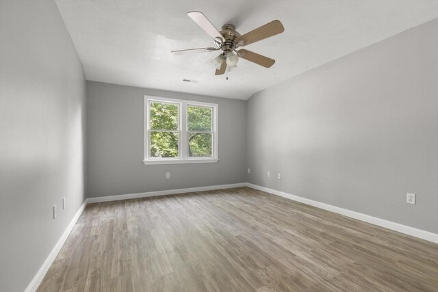 235 Groton Rd, Chelmsford, MA 01863 - empty room with wood finished floors, a ceiling fan, and baseboards