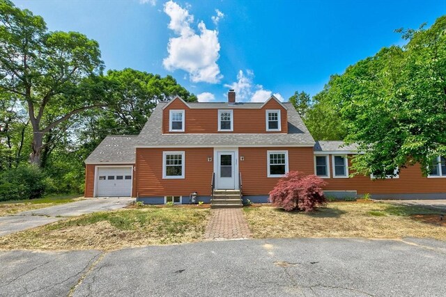 235 Groton Rd, Chelmsford, MA 01863 - view of front of home featuring driveway, a garage, entry steps, a chimney, and roof with shingles