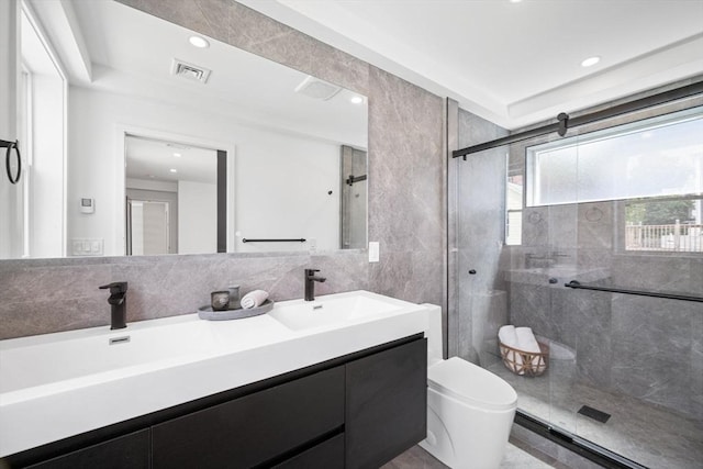 bathroom featuring vanity, tile walls, an enclosed shower, and toilet