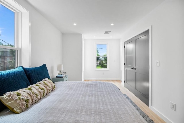 bedroom with light wood-type flooring