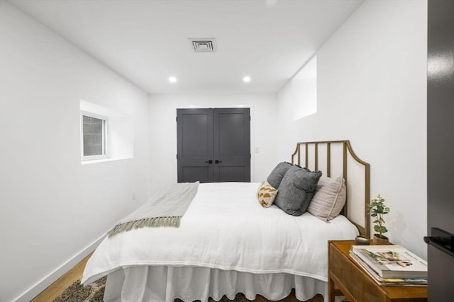 bedroom featuring hardwood / wood-style flooring