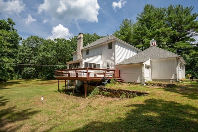 217 Grove St, Paxton, MA 01612 - back of house with a chimney, a deck, a yard, a shingled roof, and an outdoor structure