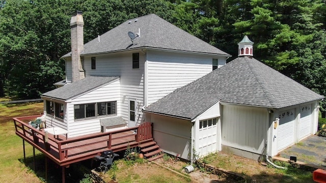 217 Grove St, Paxton, MA 01612 - rear view of property with a chimney, a shingled roof, a wooden deck, and a garage