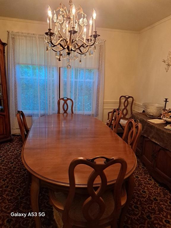 217 Grove St, Paxton, MA 01612 - dining area featuring a chandelier and crown molding