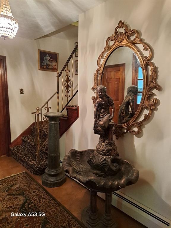 217 Grove St, Paxton, MA 01612 - detailed view of a chandelier and baseboard heating