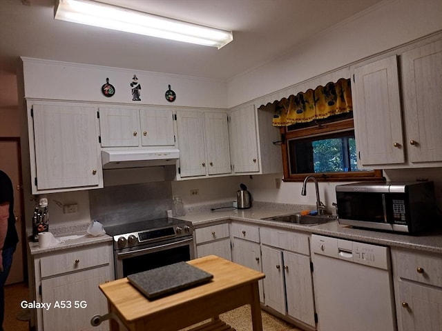 217 Grove St, Paxton, MA 01612 - kitchen featuring stainless steel appliances, a sink, under cabinet range hood, ornamental molding, and light countertops