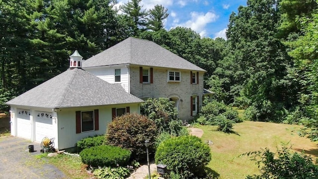 217 Grove St, Paxton, MA 01612 - view of front of house with roof with shingles, a front lawn, and an attached garage