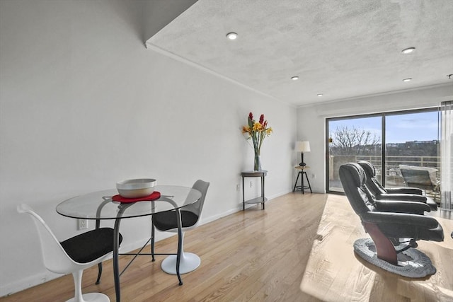 home office with light hardwood / wood-style floors