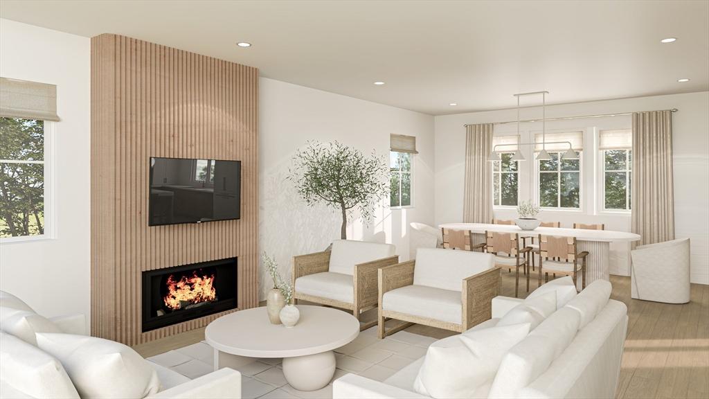 15-17 Jewett Pl Unit 2, Newton, MA 02458 - living area with healthy amount of natural light, a large fireplace, and recessed lighting