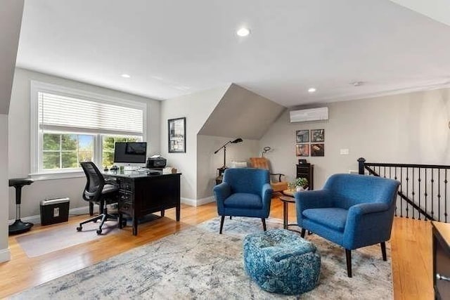 office area with a wall unit AC, wood finished floors, baseboards, and recessed lighting