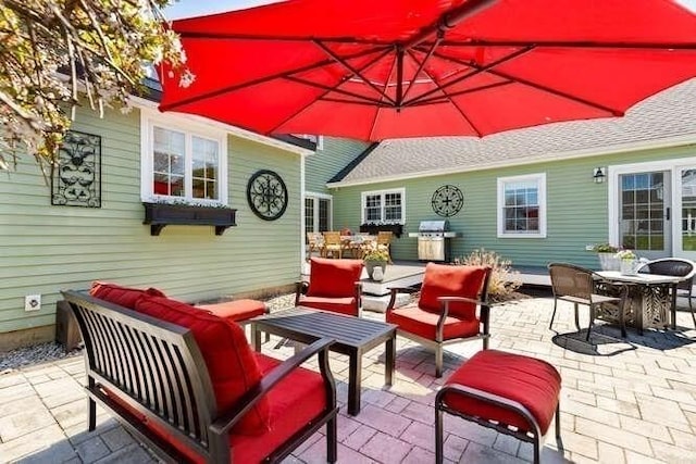 view of patio with an outdoor living space and outdoor dining area