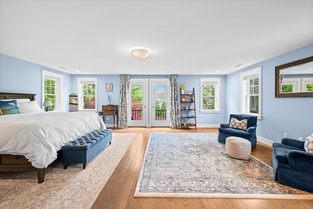26 Downing Rd, Lexington, MA 02421 - bedroom featuring access to exterior, multiple windows, wood finished floors, and baseboards