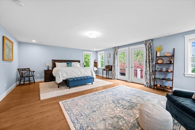 26 Downing Rd, Lexington, MA 02421 - bedroom featuring access to outside, light wood-style flooring, baseboards, recessed lighting, and french doors