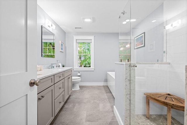 26 Downing Rd, Lexington, MA 02421 - full bathroom with toilet, vanity, a soaking tub, a tile shower, and baseboards