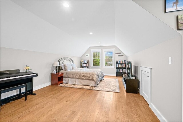 26 Downing Rd, Lexington, MA 02421 - bedroom with light wood finished floors, vaulted ceiling, baseboards, and recessed lighting