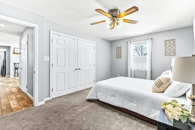 bedroom with carpet floors, a closet, and ceiling fan