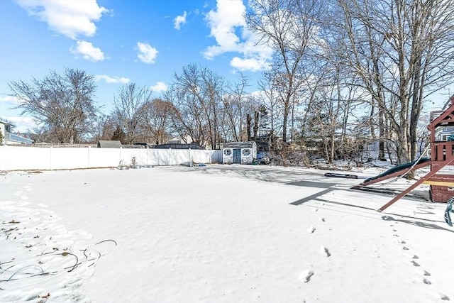 view of yard covered in snow