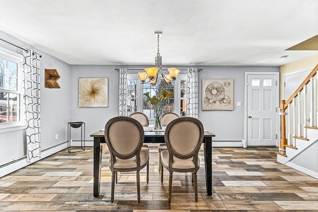 dining area featuring a baseboard radiator, dark hardwood / wood-style floors, and an inviting chandelier