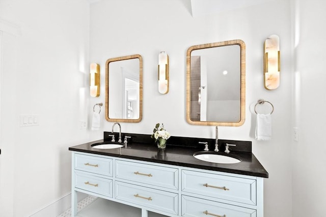 full bathroom featuring double vanity and a sink